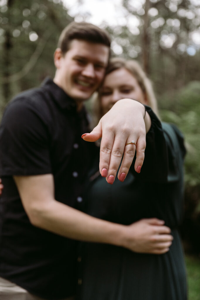 couple holding engagement ring carry your heart photography